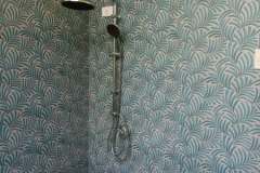 shower-assembly-on-palm-tiles-at-the-shower-room