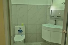 Maters-bathroom-with-lights-on-and-newsly-installed-wash-basin