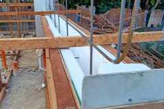 wide-ICF-forms-held-by-coco-lumber-and-tie-rods-just-before-pouring