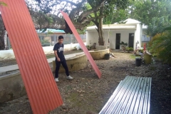 manually painting corrugated roof sheets