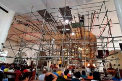 renovating a church using mixed metal and bamboo scaffolds